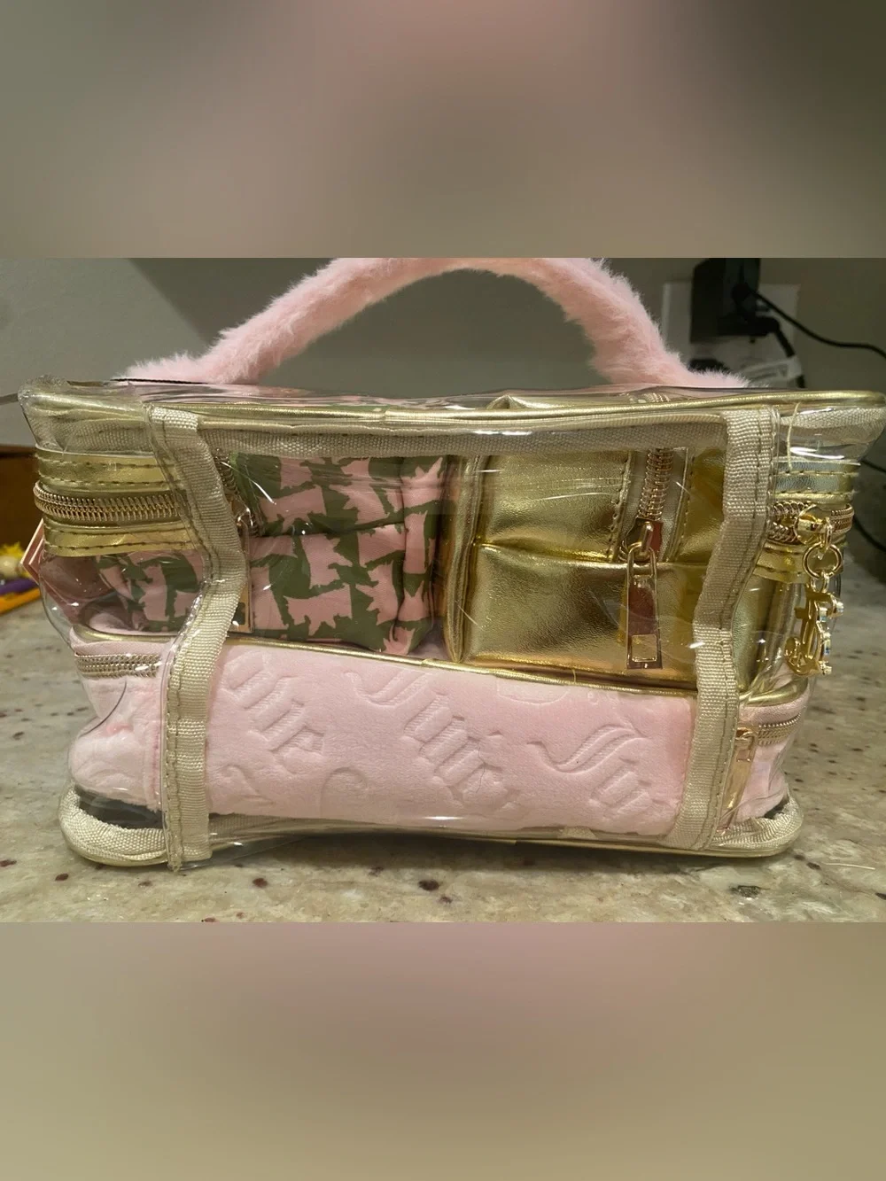 4 piece Juicy Couture Pink and Gold Quilted Cosmetic Carry Case.